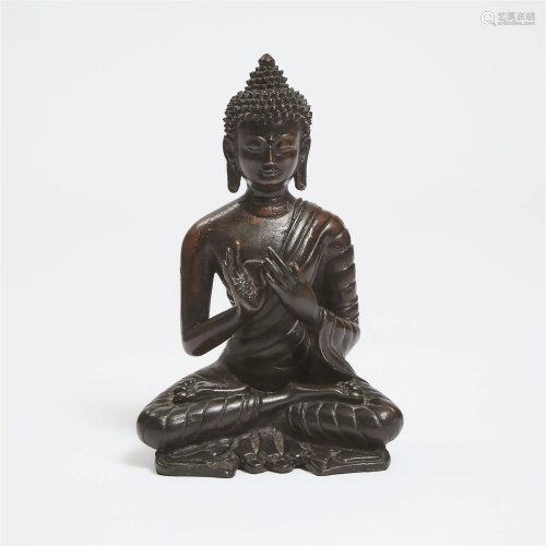 A Tibetan Bronze Seated Figure of Buddha, 18th Century or L
