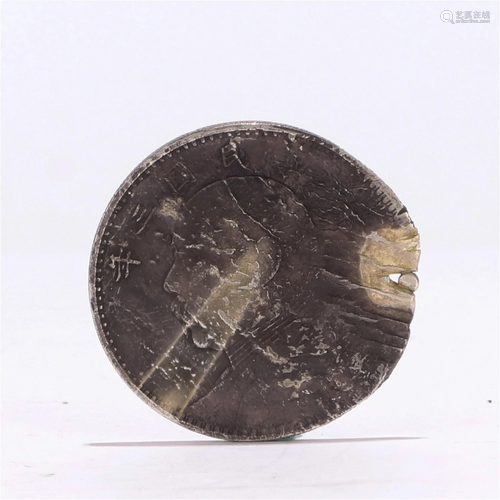 A CHINESE SILVER COIN