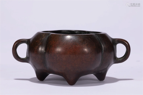 A CHINESE BRONZE TRIPOD CENSER