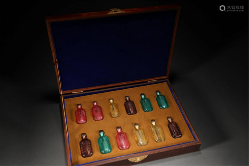 A SET OF CHINESE PEKING GLASS TWELVE SNUFF BOTTLES