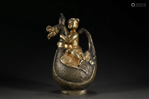 A CHINESE GILDING BOY EWER