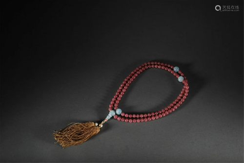 A CHINESE RUBY BUDDHIST BEADS