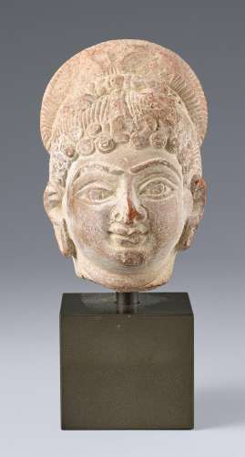 A small red terracotta head of a female. Central India. Poss...