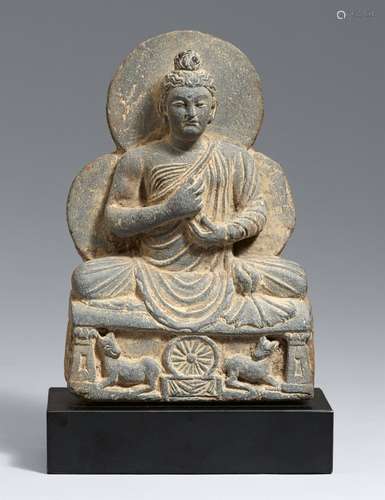 A small grey schist Gandhara stele of the preaching Buddha. ...