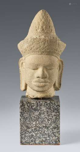 A Cambodian sandstone head of a deity.