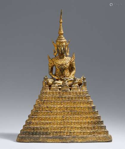 A gilt and lacquered bronze figure of a crowned and bejewell...