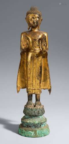 An Ayutthaya-style gilded and lacquered bronze figure of a B...