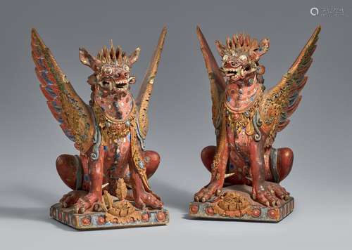 Two Bali polychromed wood figures of winged lions (singha). ...