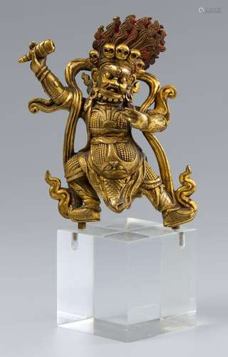 A Sinotibetan gilt bronze figure of Dharmapala Begtse (Beg-t...