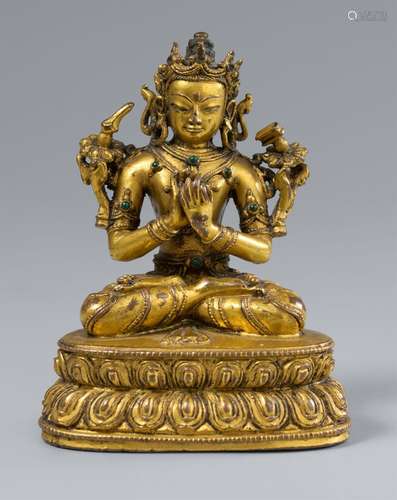 A gilt bronze figure of Dharmacakramanjusri. Tibet. In the s...