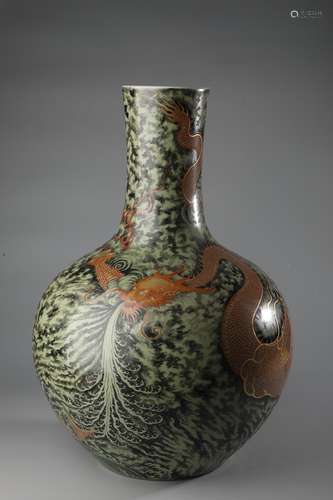 A SANCAI RED DRAGON BOTTLE VASE