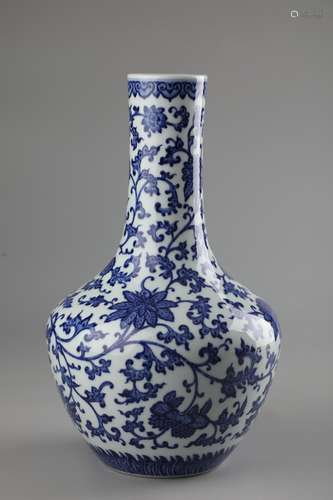 A BLUE AND WHITE LOTUS BEAKER VASE