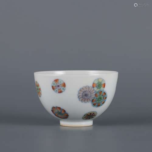 A DOUCAI scattered roundels of flowers CUP