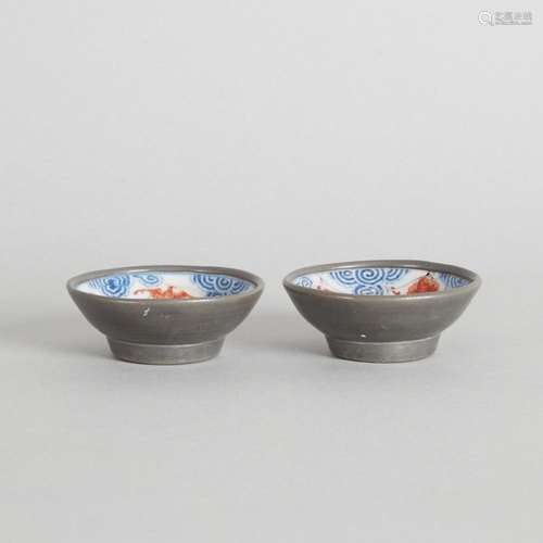 A Pair of Chinese Blue and White Iron-Red 'Bat' Sauc...