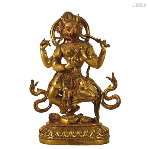 A Gilt-Bronze Figure Of Jambhala With An Elephant's Hea...