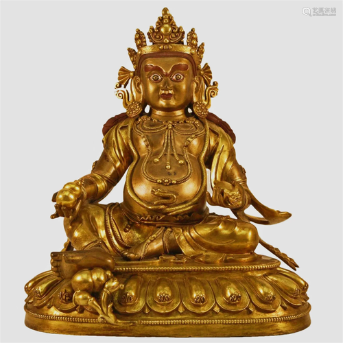 A Gilt-Bronze Figure Of Jambhala