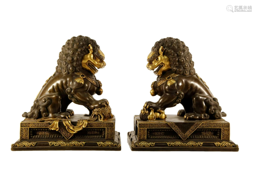 A Pair of Gilt-Bronze Lion Ornaments