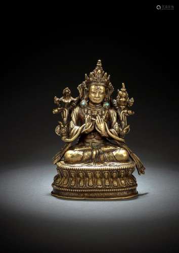 A FINE SILVER-INLAID AND INSCRIBED BRONZE FIGURE OF MAITREYA