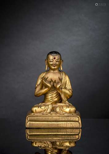 A FINE GILT-BRONZE FIGURE OF AN ARHAT