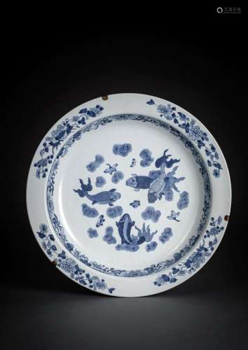 A LARGE BLUE AND WHITE DEEP FISH PLATE FROM THE NANKING CARG...