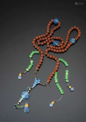 A RARE CARVED FRUIT NUT AND GLASS COURT NECKLACE
