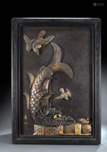 A LARGE IRON PANEL WITH A MIXED METAL DRAGON FISH IN HIGH RE...