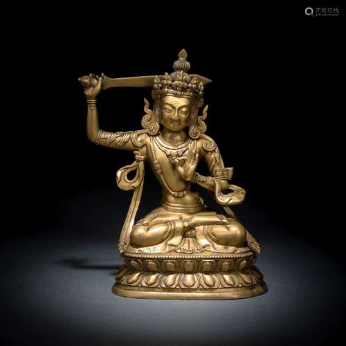 A BRONZE FIGURE OF MANJUSHRI SEATED ON A LOTUS THRONE