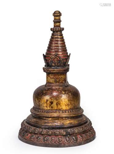 A GILT-COPPER EMBOSSED STUPA