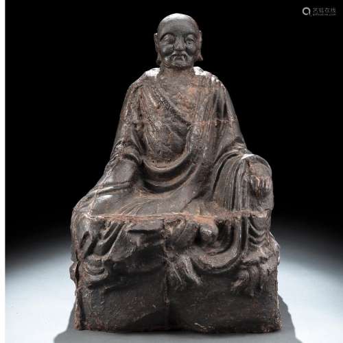 A CAST-IRON FIGURE OF A SEATED LOUHAN