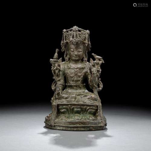 A BRONZE FIGURE OF SAMANTHABADRA ON A LOTUS WITH GREEN PATIN...