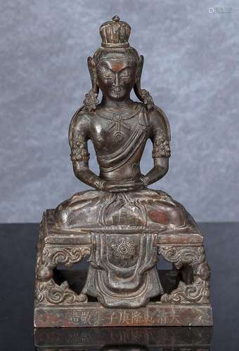 A BRONZE FIGURE OF AMITAYUS SEATED ON A THRONE