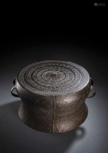 A LARGE BRONZE DRUM WITH ORNAMENTAL DECORATION