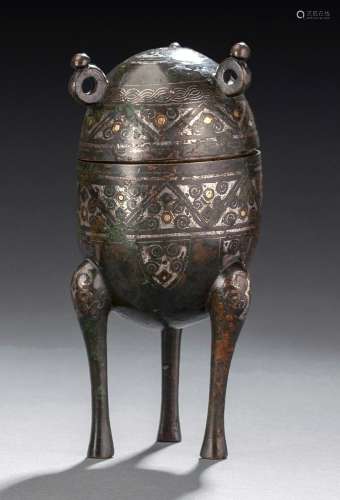 A TRIPOP BRONZE VESSEL AND COVER IN ARCHAIC STYLE WITH GOLD-...