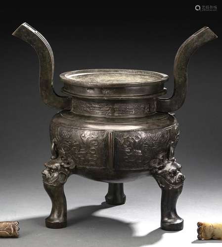 A BRONZE TRIOD CENSER WITH HANDLES