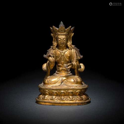 A GILT-BRONZE FIGURE OF A BODHISATTVA, POSSIBLY KSHITIGHARBA