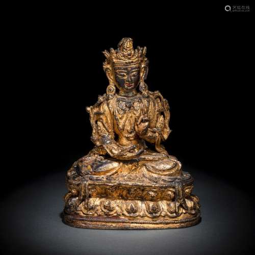 A GILT-LACQUERED BRONZE FIGURE OF A BODHISATTVA SEATED ON A ...