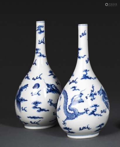 A PAIR OF BLUE AND WHITE DRAGON BOTTLE VASES