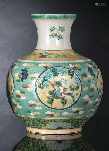 A BISCUIT DAOIST EMBLEM AND FLOWER VASE