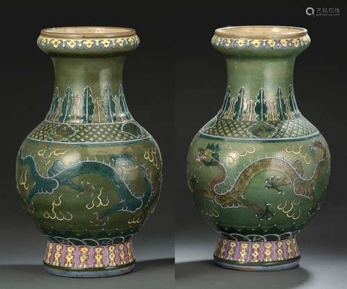 A PAIR OF GREEN GROUND FAMILLE ROSE DRAGON VASES