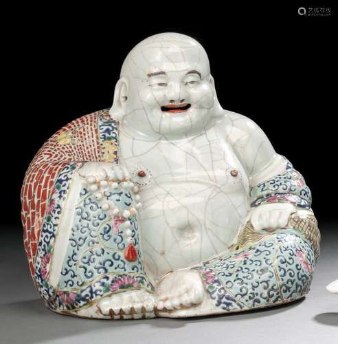 A FAMILLE ROSE FIGURE OF SEATED BUDAI