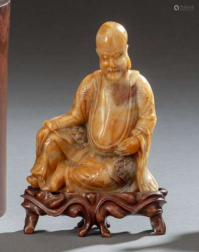 A CARVED AND ENGRAVED SOAPSTONE FIGURE OF SEATED SHOULAO ON ...