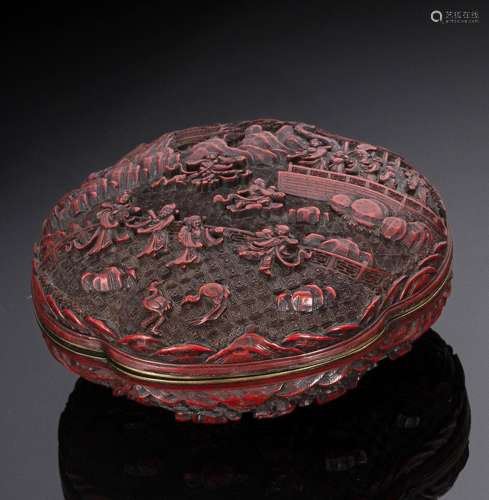 A WELL CARVED CINNABAR LACQUER BOX AND COVER DECORATED ON BO...