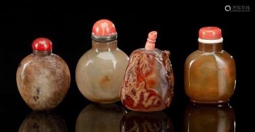 A GROUP OF TWO PLAIN AGATE SNUFF BOTTLES AND TWO CARVED AND ...