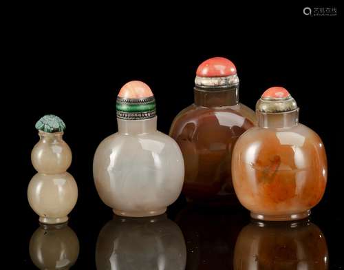 THREE PLAIN NEAR-GLOBULAR SNUFF BOTTLES AND A GOURD SHAPE SN...