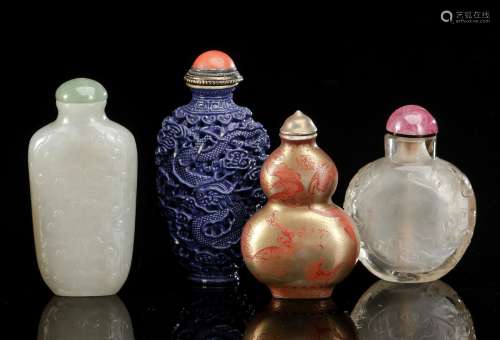 FOUR SNUFFBOTTLES: JADE, CRYSTAL AND TWO PORCELAIN SNUFFBOTT...