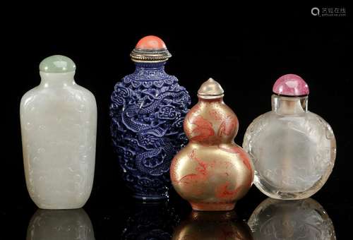 FOUR SNUFFBOTTLES: JADE, CRYSTAL AND TWO PORCELAIN SNUFFBOTT...