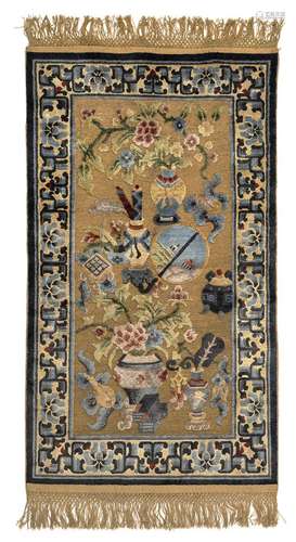 A METAL-BROCATED SILK CARPET WITH ANTIQUES