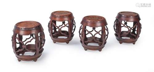 FOUR DRUM-SHAPED WOOD STOOLS