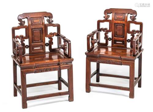 A PAIR OF WOOD ARMCHAIRS WITH VOLUTE CARVING