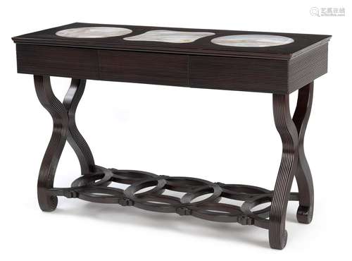 A DARK WOOD TABLE WITH MARBLE TOPS AND CROSS-SHAPED LEGS